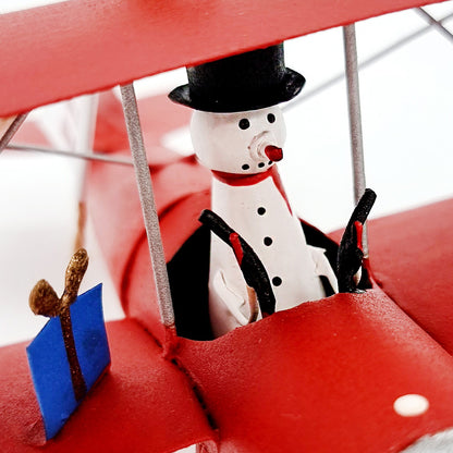Bonhomme de neige et Père Noël dans l'avion